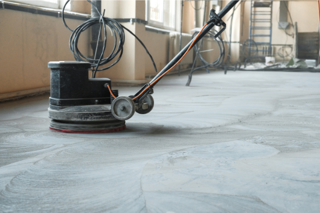Grinding of concrete floor with a rotating machine
